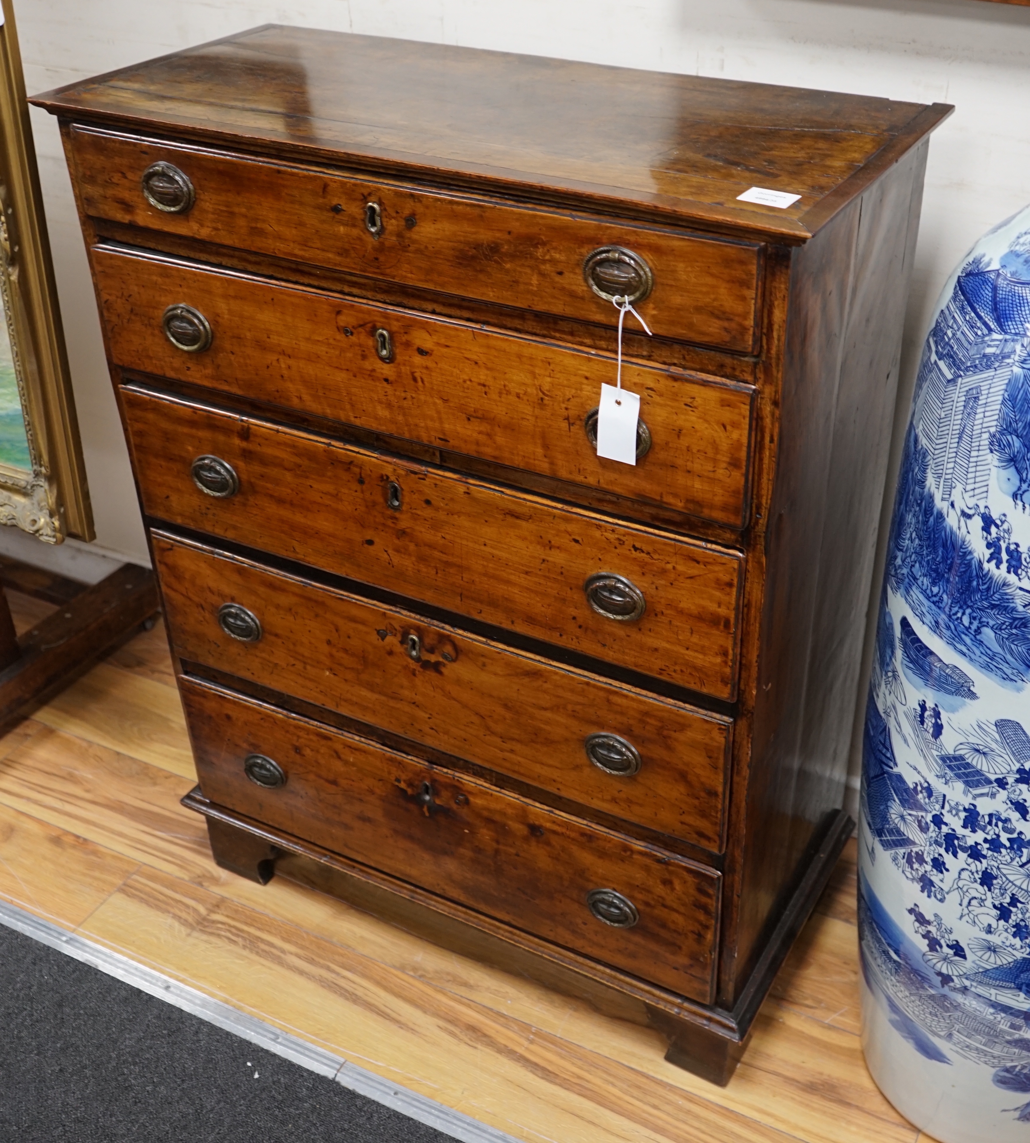 A George III fruitwood chest of five graduating long drawers, width 79cm depth 36cm height 102cm